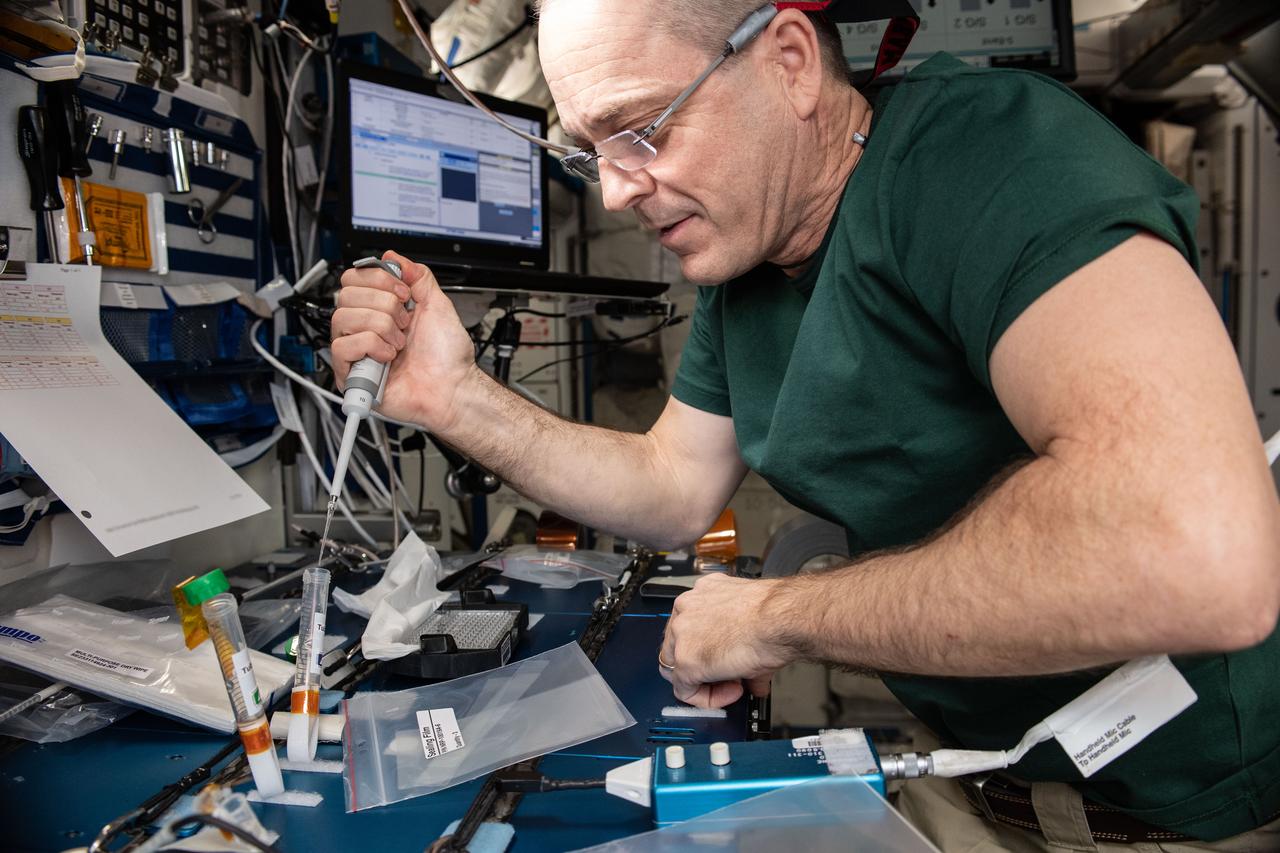 iss056e142862_alt (8/13/2018) --- Astronaut Ricky Arnold prepares samples for the Barrios Protein Crystal Growth (Barrios PCG) experiment in the Maintenance Work Area (MWA) of the International Space Station (ISS). The Barrios PCG experiment defined an approach for optimizing protein crystallization conditions on orbit, eliminating the need to return samples to the ground during the optimization phase, which has the potential for saving substantial time and money on future PCG investigations in microgravity.