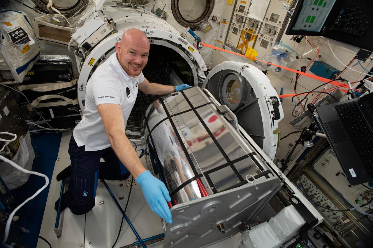 iss056e148119 (8/20/2018) --- Astronaut Alexander Gerst of ESA (European Space Agency) prepares the German Space Agency (DLR) Earth Sensing Imaging Spectrometer (DESIS) investigation for installation. DESIS verifies and enhances the use of space-based hyperspectral imaging capabilities for Earth remote sensing and provides an instrument which produces high value hyperspectral imagery