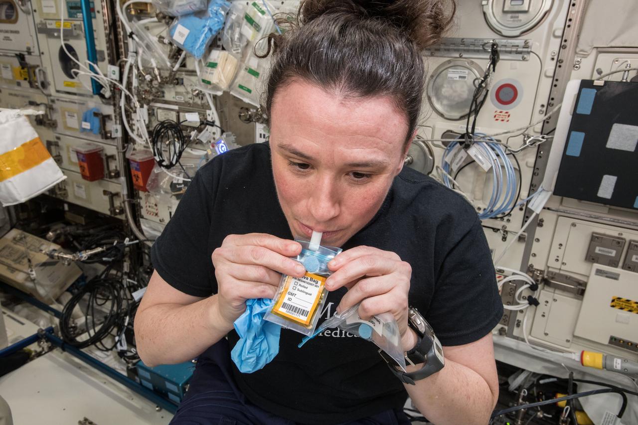 iss056e200842 (10/3/2018) - NASA astronaut Serena Auñón-Chancellor, during Functional Immune saliva collection at the Human Research Facility (HRF), in the Columbus Module. The Functional Immune investigation analyzes blood and saliva samples to determine the changes taking place in crew members’ immune systems during flight.