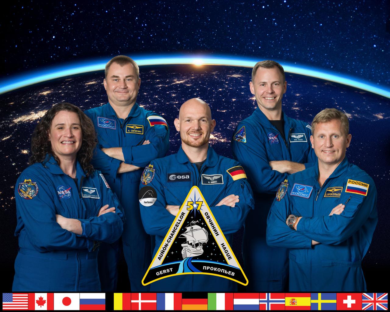 iss057-s-002 (November 8, 2017) --- The official portrait of the five-member Expedition 57 crew. In the front row from left are Serena Auñón-Chancellor of NASA, Commander Alexander Gerst from the European Space Agency and Sergei Prokopev of Roscosmos. In the back row from left are Flight Engineers Aleksey Ovchinin of Roscosmos and Nick Hague from NASA.