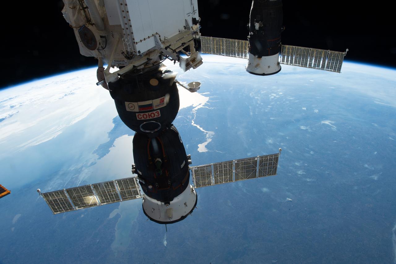 iss057e050440 (Oct. 13, 2018) --- Two Russian spacecraft, the Soyuz MS-09 crew ship (foreground) and the Progress 70 resupply ship, are pictured docked to the International Space Station as the orbital complex orbited nearly 257 miles above Ukraine.