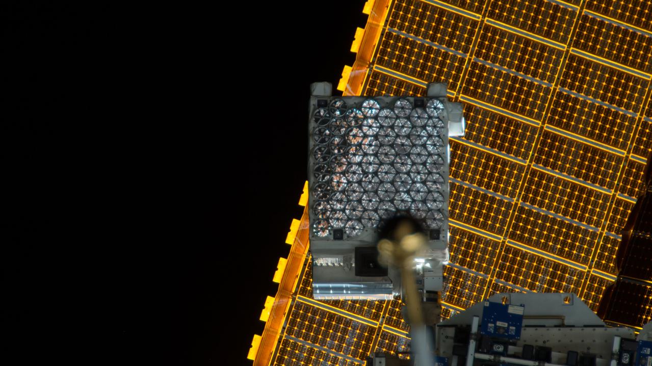 iss057e055460 (10/22/2018) --- View of the Neutron Star Interior Composition ExploreR (NICER) payload, attached to ExPRESS (Expedite the Processing of Experiments to Space Station) Logistics Carrier-2 (ELC-2) on the S3 Truss. Photo was taken by the ground-controlled External High Definition Camera 1 (EHDC1). NICER's primary mission to perform an in-depth study of neutron stars offers unrivaled astrophysics knowledge and can revolutionize the understanding of ultra-dense matter.