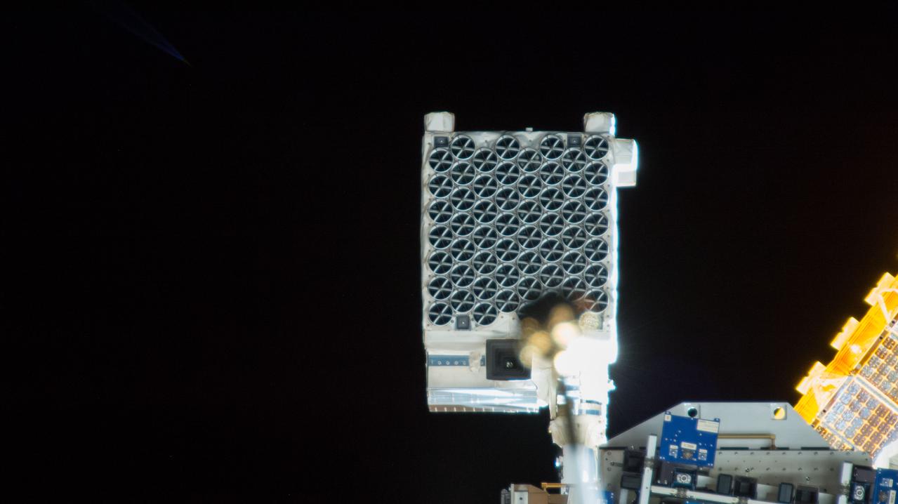 iss057e055482 (10/22/2018) --- View of the Neutron Star Interior Composition ExploreR (NICER) payload, attached to ExPRESS (Expedite the Processing of Experiments to Space Station) Logistics Carrier-2 (ELC-2) on the S3 Truss. Photo was taken by the ground-controlled External High Definition Camera 1 (EHDC1). NICER's primary mission to perform an in-depth study of neutron stars offers unrivaled astrophysics knowledge and can revolutionize the understanding of ultra-dense matter.