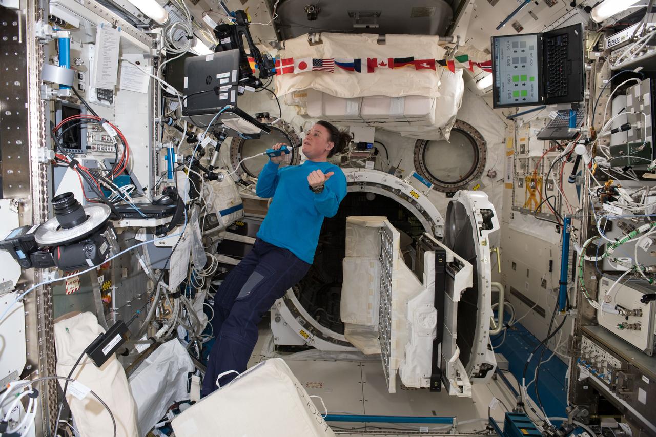 iss057e105379 (Nov. 21, 2018) --- NASA astronaut Serena Auñón-Chancellor talks to mission controllers while working on life support maintenance inside the Kibo laboratory module from the Japan Aerospace Exploration Agency.