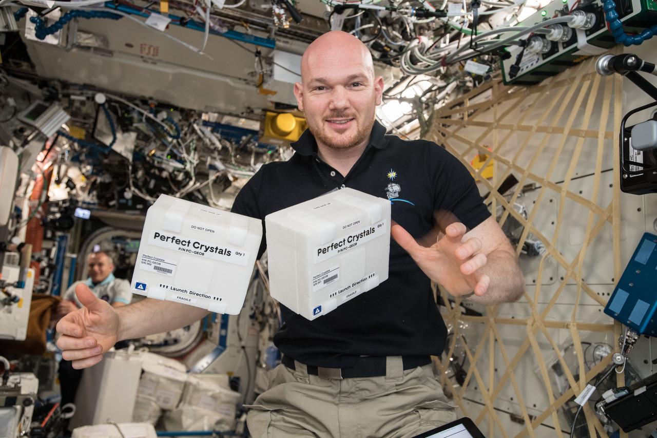 iss057e114747 (12/9/2018) --- European Space Agency (ESA) astronaut Alex Gerst is photographed with the Perfect Crystals investigation. Perfect Crystals studies human manganese superoxide dismutase (MnSOD or SOD2) in order to analyze its shape. MnSOD is implicated in a number of human diseases, including non-Hodgkins lymphoma, lung cancer and colorectal cancer. Understanding how it works is an important step toward developing better prevention and treatment methods for such diseases.