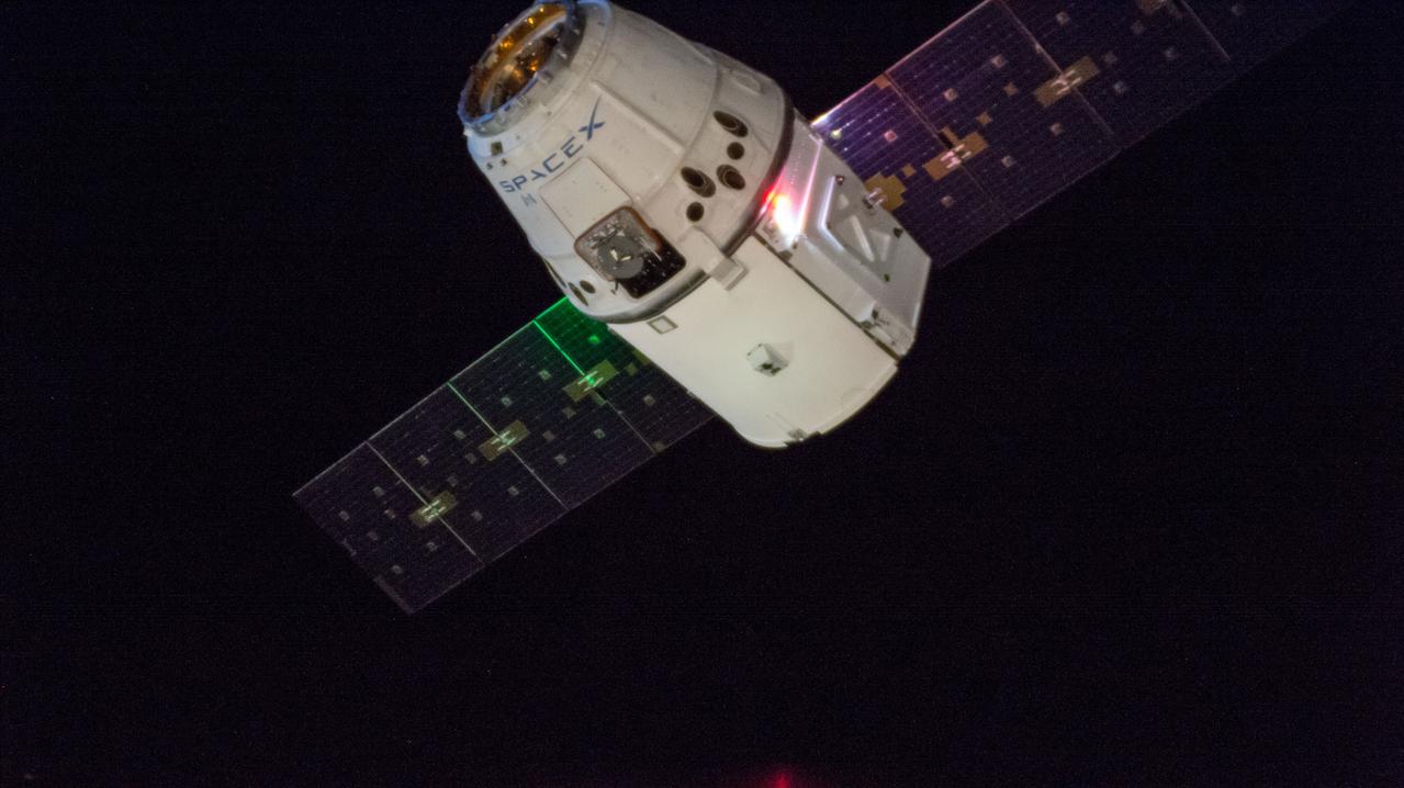 iss057e115424 (Dec. 8, 2018) --- The SpaceX Dragon cargo craft slowly approaches the International Space Station. Astronauts Alexander Gerst and Serena Auñón-Chancellor were monitoring Dragon from inside the cupola and preparing to slowly reach out and grapple the cargo craft with the Canadarm2 robotic arm. Dragon, packed with over 5,600 pounds of cargo, completed a three-day trip to the International Space Station that began with a launch from Cape Canaveral Air Force Station in Florida and ended with its installation and hatch opening on the Harmony module..
