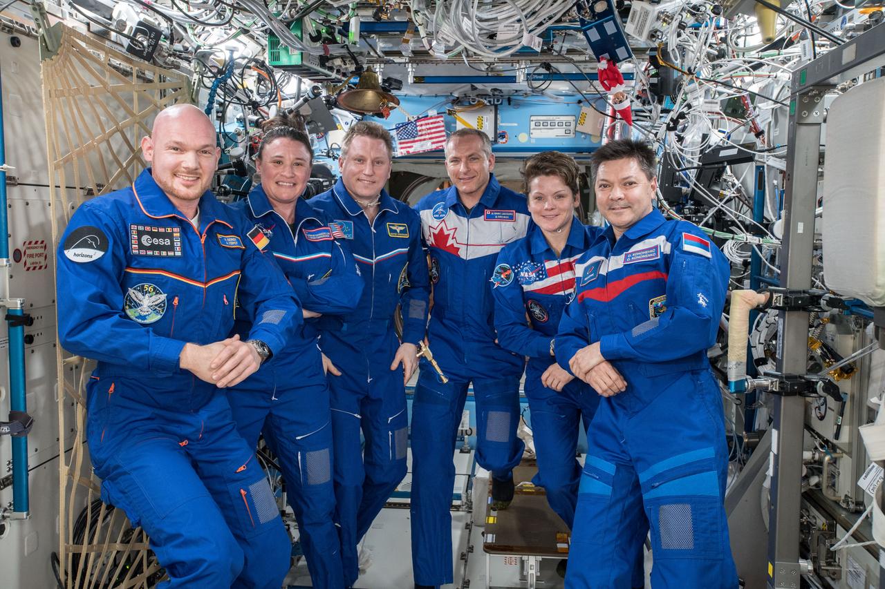 iss057e134727 (Dec. 18, 2018) --- Expedition 56-57 crew members (from left) Alexander Gerst of the ESA (European Space Agency), Serena Auñón-Chancellor of NASA and Sergey Prokopyev from Roscosmos; with Expedition 57-58 crew members David Saint-Jacques of the Canadian Space Agency (CSA), Anne McClain of NASA and Oleg Kononenko from Roscosmos.