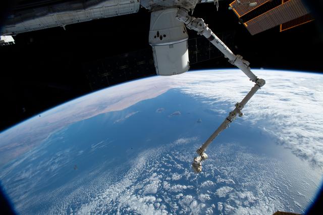 NASA image: The SpaceX Dragon cargo craft and the Canadarm2 robotic arm