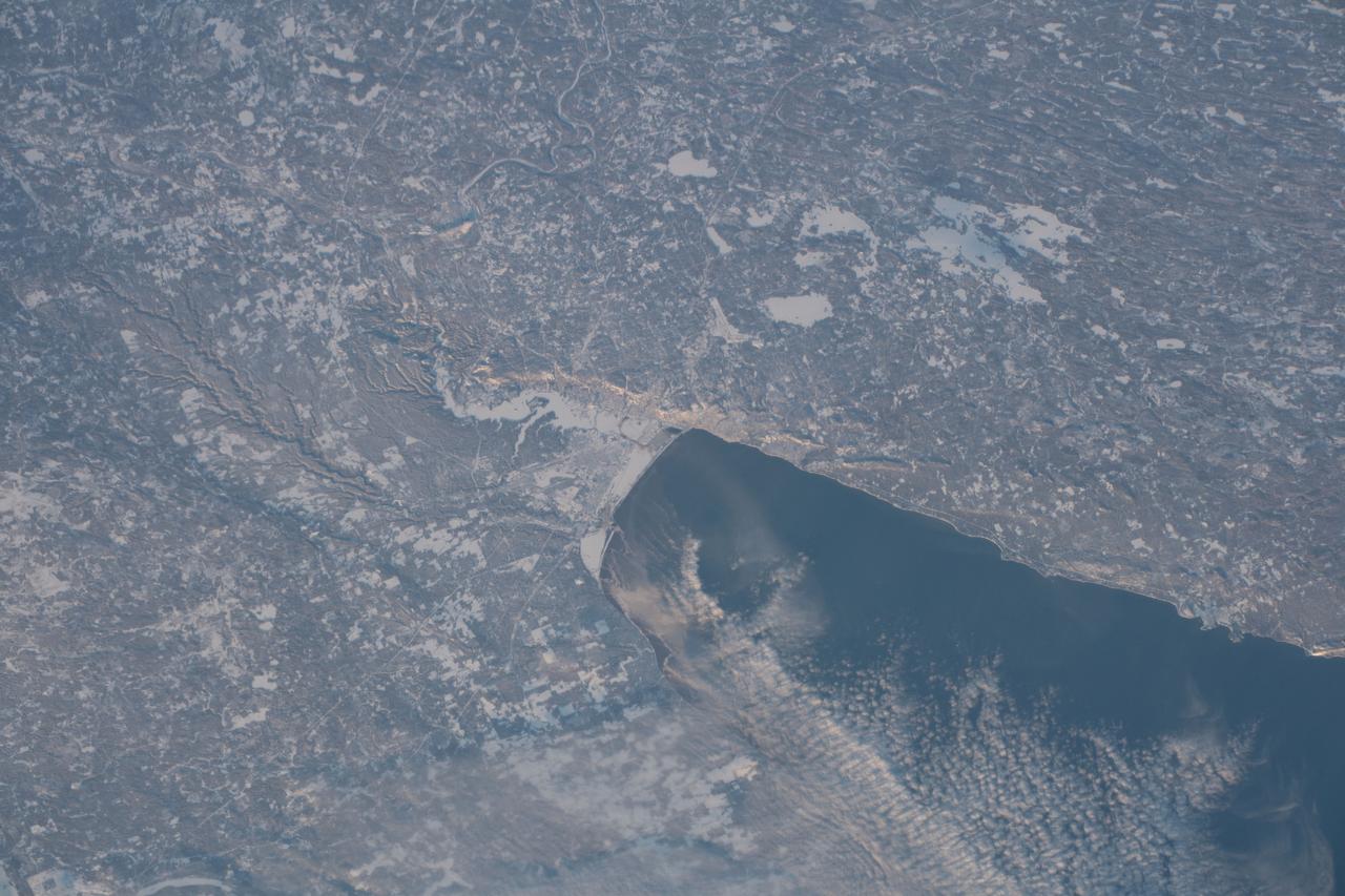iss058e001857 (Jan. 1, 2019) --- The western tip of Lake Superior and the cities of Duluth, Minnesota and Superior, Wisconsin separated by the frozen St. Louis River, are pictured from the International Space Station on New Year's Day 2019.