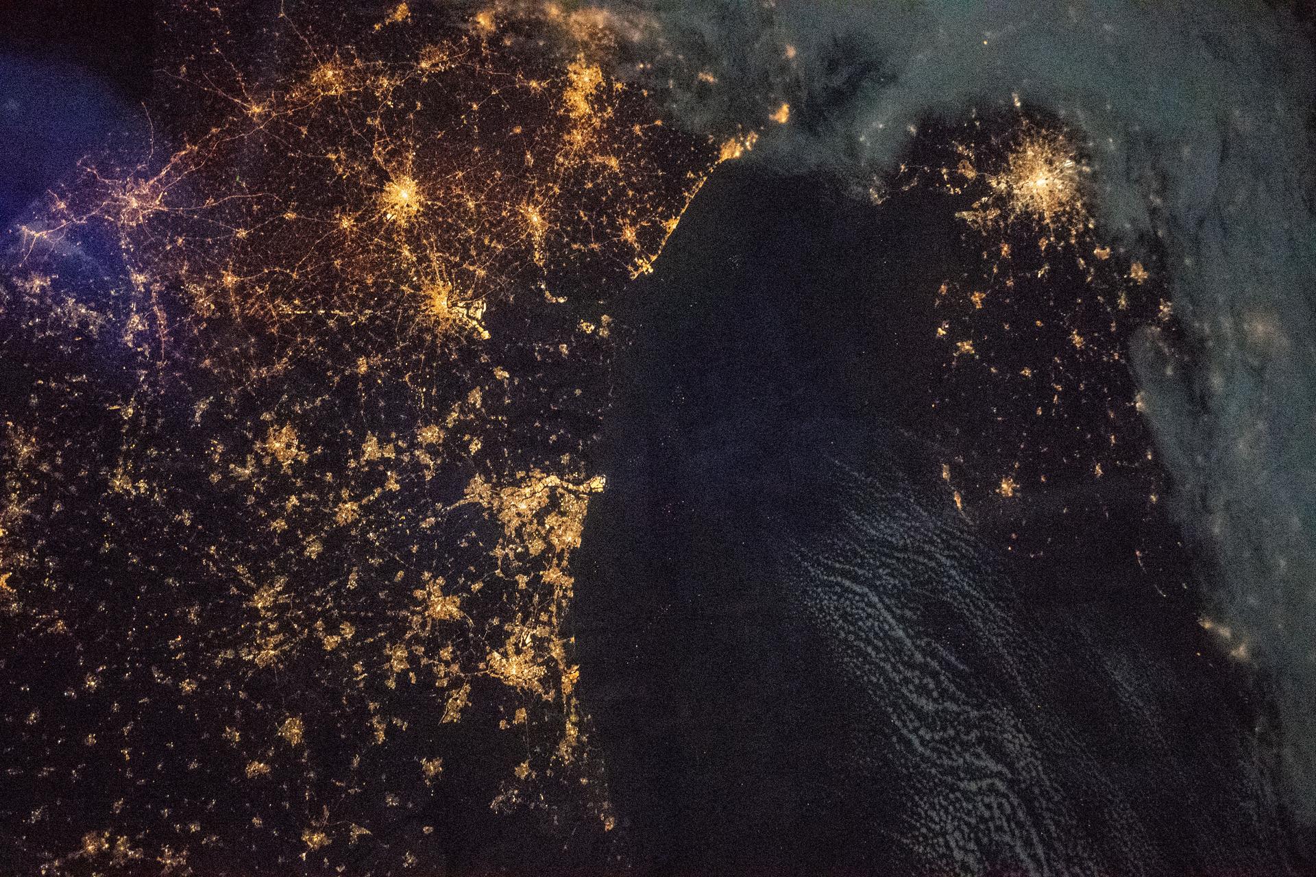 This nighttime shot from the International Space Station taken 258 miles above the English Channel shows the lights of the northern European cities of (clockwise from top right) London, Amsterdam, The Hague, Rotterdam, Antwerp and Brussels and other surrounding cities.