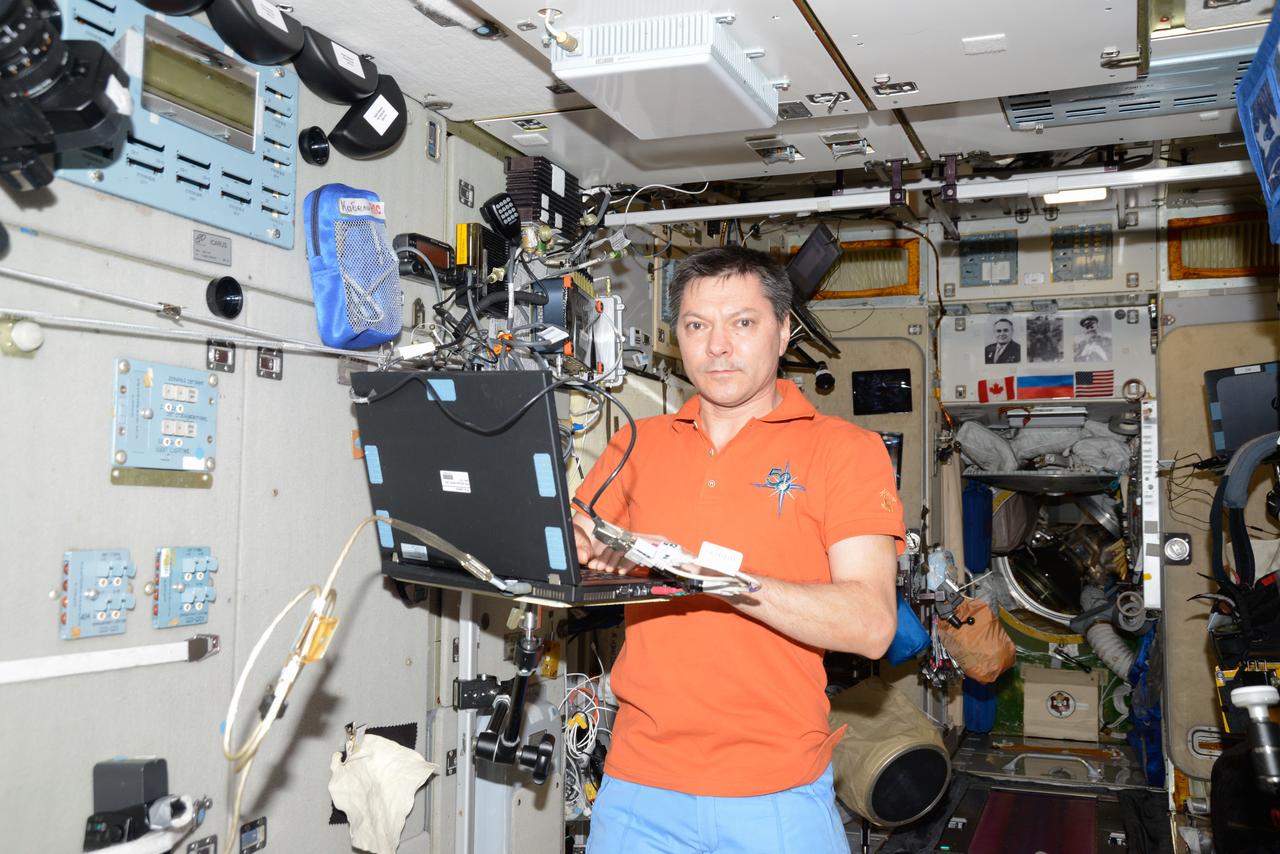 iss058e007788 (Jan. 30, 2019) --- Expedition 58 Commander Oleg Kononenko of Roscosmos is pictured in the Zvezda service module at the end of the work day wrapping up science operations on a laptop computer. Credit: Roscosmos