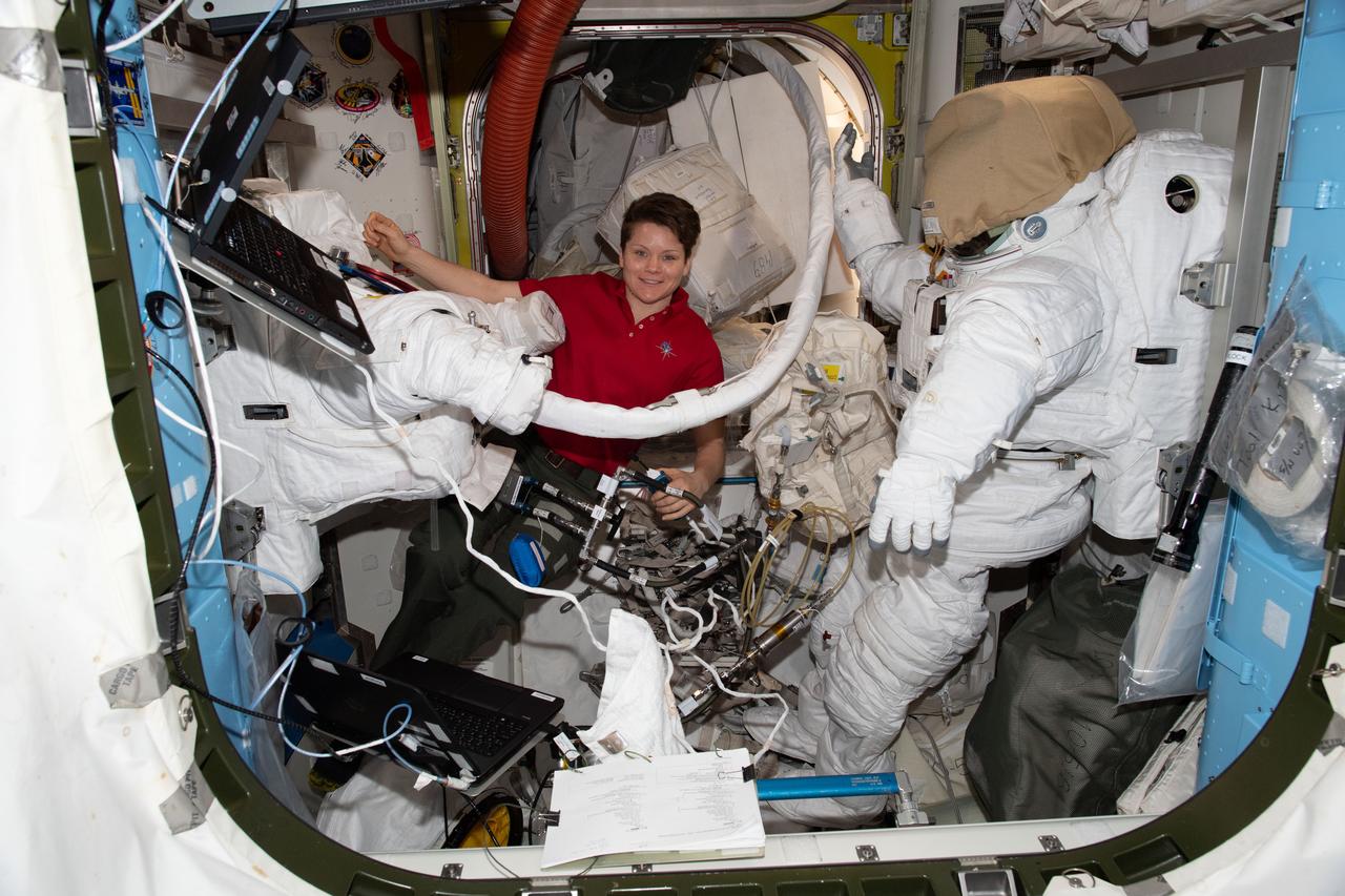 iss058e011974 (Feb. 7, 2019) --- NASA astronaut Anne McClain works inside the International Space Station's Quest joint airlock. The Expedition 58 Flight Engineer was working on U.S. spacesuit maintenance emptying and refilling water in the suits' cooling loops.