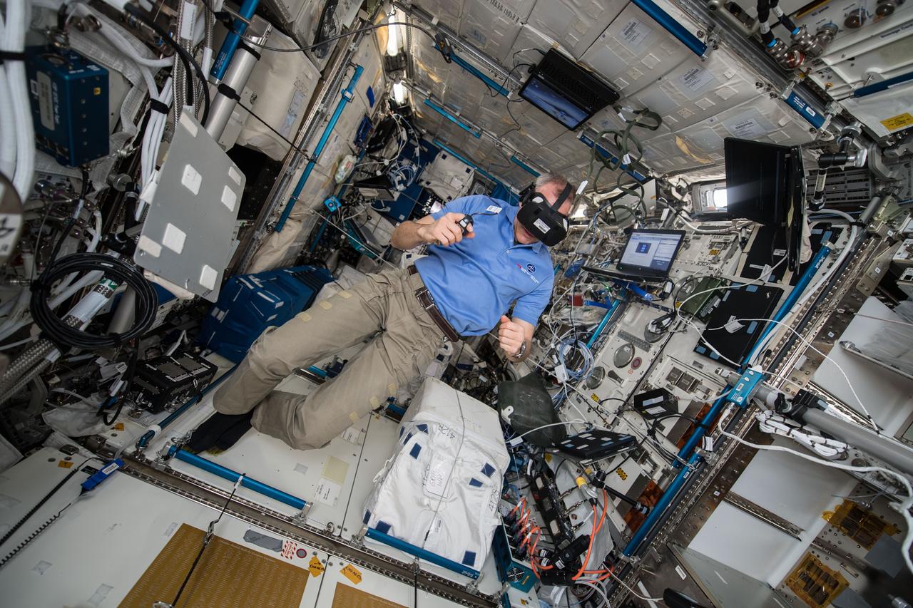 iss058e013795 (2/15/2019) --- Canadian Space Agency (CSA) astronaut David Saint-Jacques is shown onboard the International Space Station (ISS) performing the Time Perception in Microgravity investigation. The goal of the Time Perception in Microgravity experiment is to investigate the perception of time to crew members aboard the International Space Station (ISS). Crewmembers are asked to evaluate or reproduce the display duration of a blue square presented in the center of the head-mounted display. The results are compared with pre- and postflight baselines.