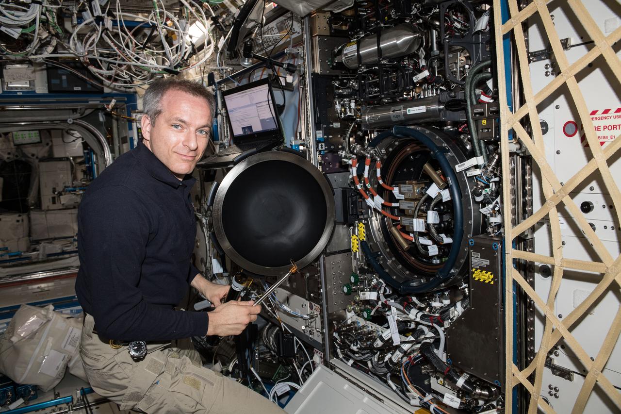 iss058e026380 (Feb. 26, 2019) --- Astronaut David Saint-Jacques of the Canadian Space Agency is inside the U.S. Destiny laboratory module working on the Combustion Integrated Rack. Saint-Jacques replaced fuel flow controllers inside the device for the Advanced Combustion via Microgravity Experiments which are a set of five independent studies of gaseous flames.
