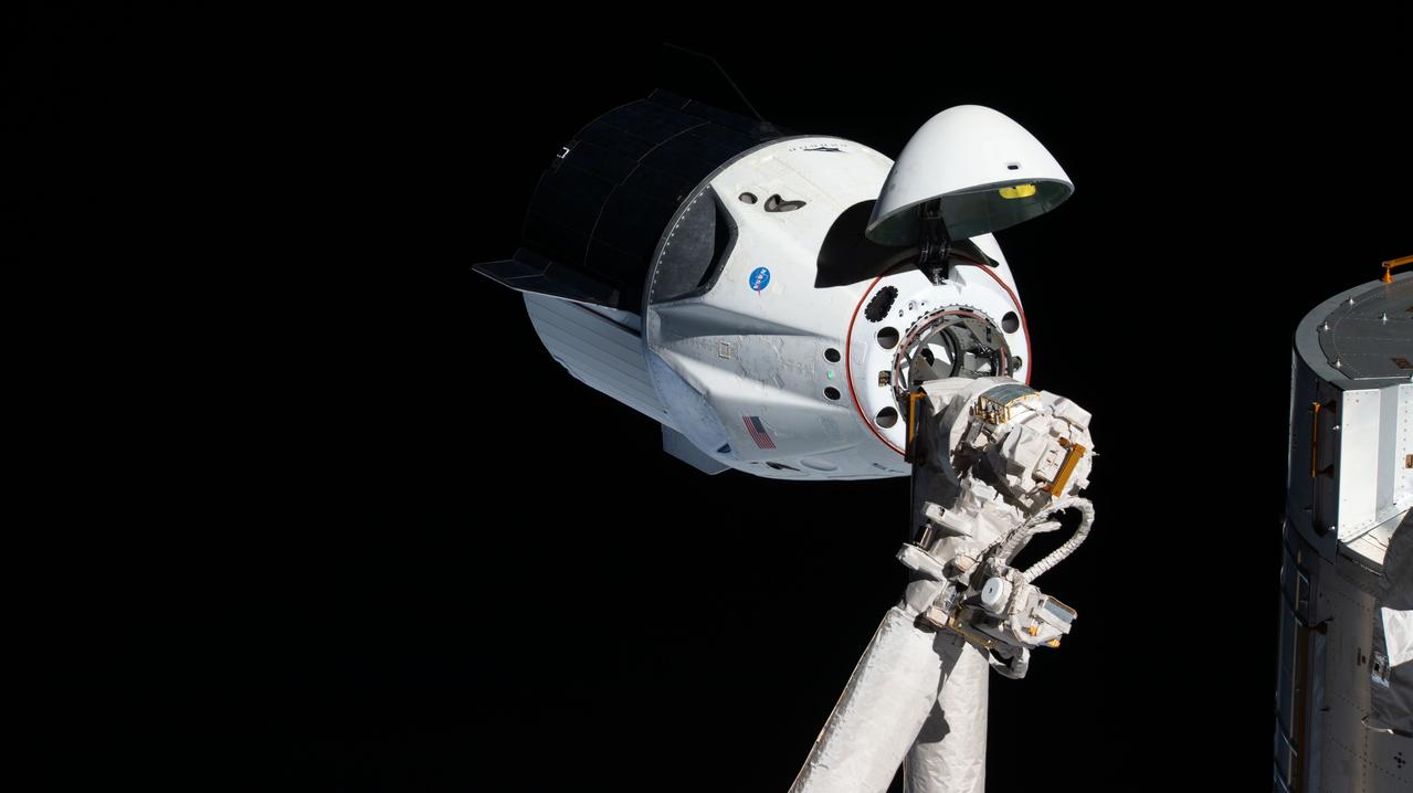 iss058e027464 (March 4, 2019) --- The uncrewed SpaceX Crew Dragon spacecraft is the first Commercial Crew vehicle to visit the International Space Station. Here it is pictured with its nose cone open revealing its docking mechanism while approaching the station's Harmony module. The Crew Dragon would automatically dock moments later to the international docking adapter attached to the forward end of Harmony.