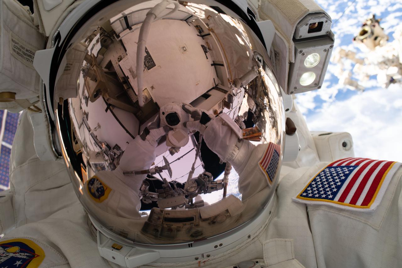 iss059e002710 (March 22, 2019) --- NASA astronaut Nick Hague takes an out-of-this-world "space-selfie" 250 miles above Earth during a spacewalk to upgrade the International Space Station's power storage capacity. This was Hague's and NASA astronaut Anne McClain's (out of frame) first spacewalk.
