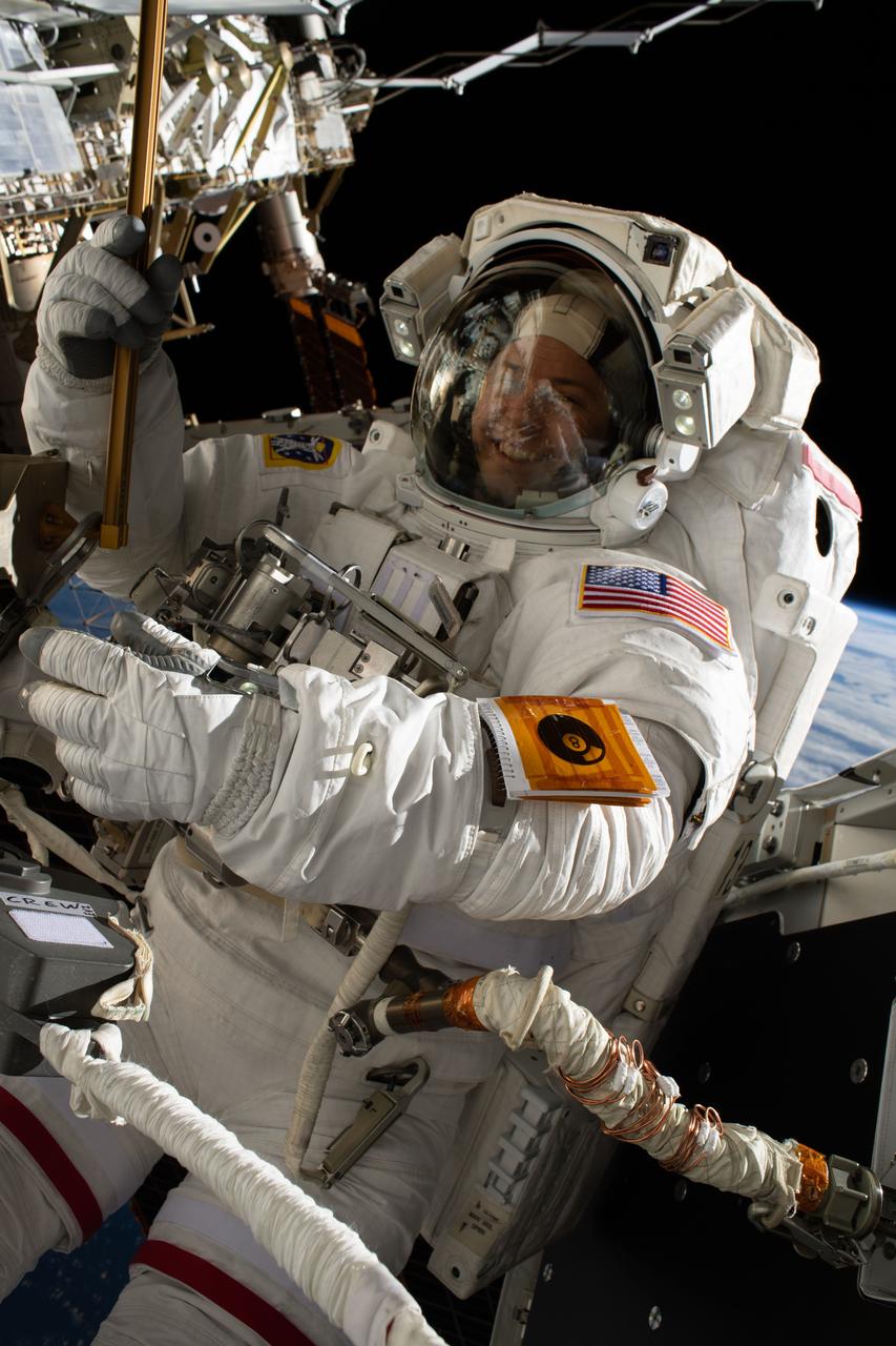 iss059e005677 (March 29, 2019) --- NASA astronaut Nick Hague participates in his second spacewalk to upgrade the International Space Station's power storage capacity. He and fellow spacewalker Christina Koch (out of frame) of NASA worked outside in the vacuum of space for six hours and 45 minutes to continue swapping batteries and install adapter plates on the station's Port-4 truss structure.
