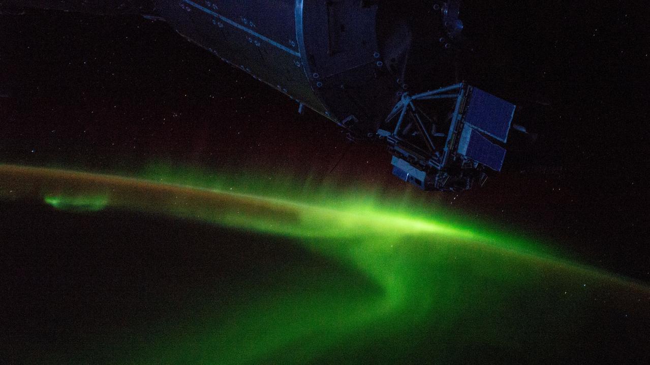 iss059e013118 (April 4, 2019) --- The aurora australis swirls above the Indian Ocean south of Australia as the International Space Station orbited 265 miles over Earth. A portion of the dimly-lit Columbus laboratory module from ESA (European Space Agency) is seen in the top foreground.