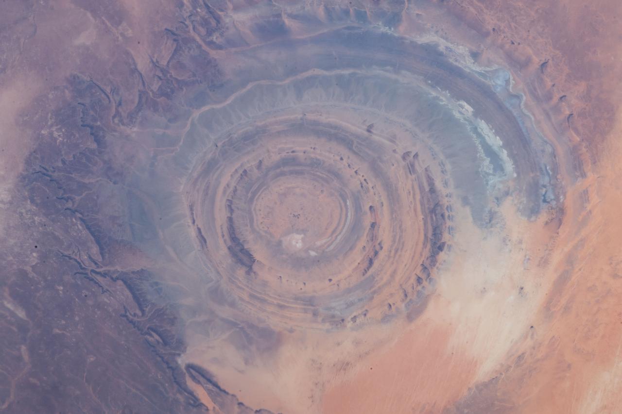 iss059e013137 (March 5, 2019) --- From an altitude of 255 miles, an Expedition 59 crewmember photographed the Richat Structure, or the "Eye of the Sahara," in northwestern Mauritania. The circular geologic feature is thought to be caused by an uplifted dome—geologists would classify it as a domed anticline—that has been eroded to expose the originally flat rock layers.