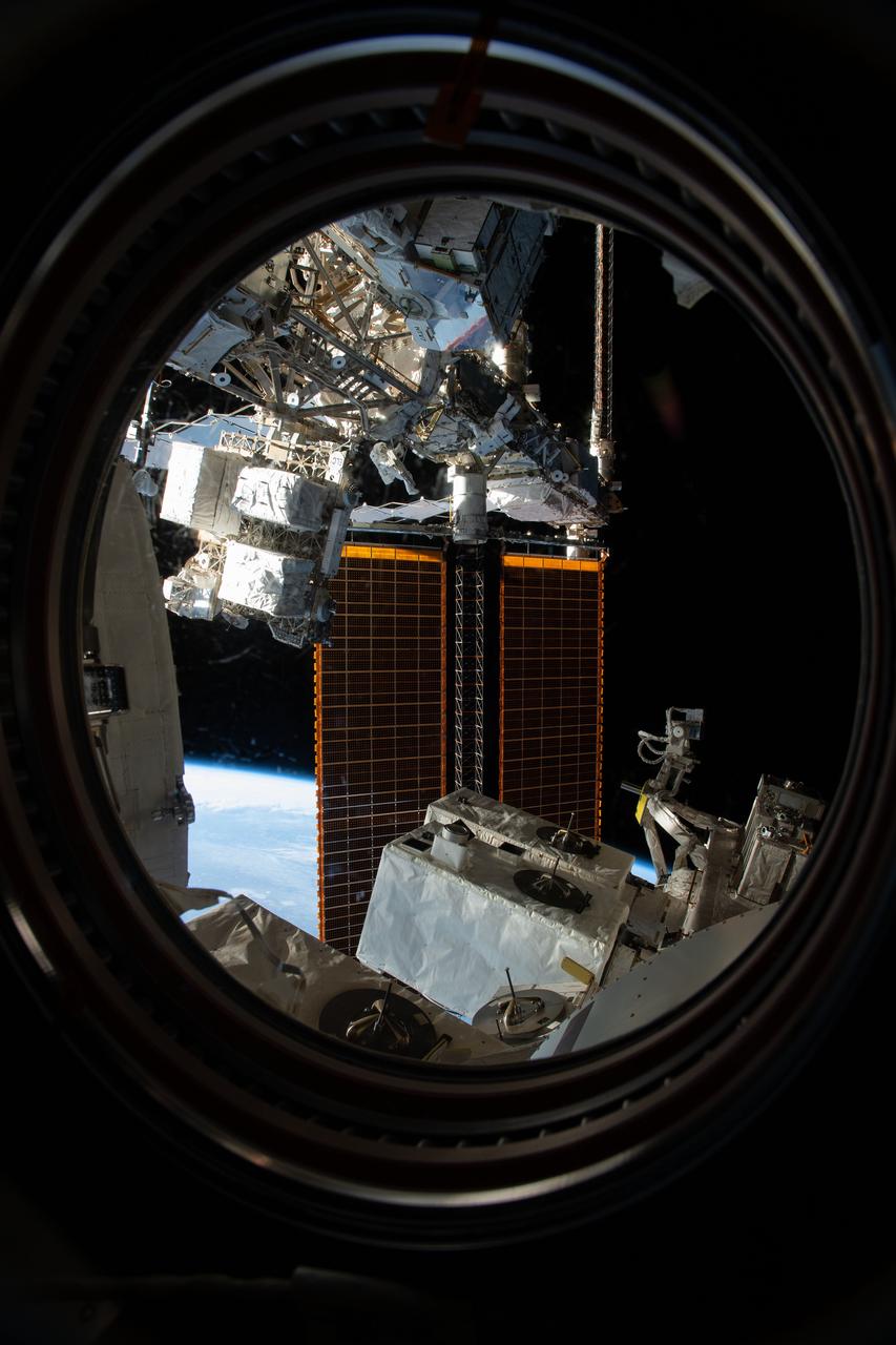 iss059e016956 (April 8, 2019) --- Expedition 59 Flight Engineers Anne McClain of NASA and David Saint-Jacques of the Canadian Space Agency are seen while working outside the International Space Station. In a six and a half hour spacewalk, McClain and Saint-Jacques successfully established a redundant path of power to the Canadian-built robotic arm, known as Canadarm2, and installed cables to provide for more expansive wireless communications coverage outside the orbital complex, as well as for enhanced hardwired computer network capability. The duo also relocated an adapter plate from the first spacewalk in preparation for future battery upgrade operations.
