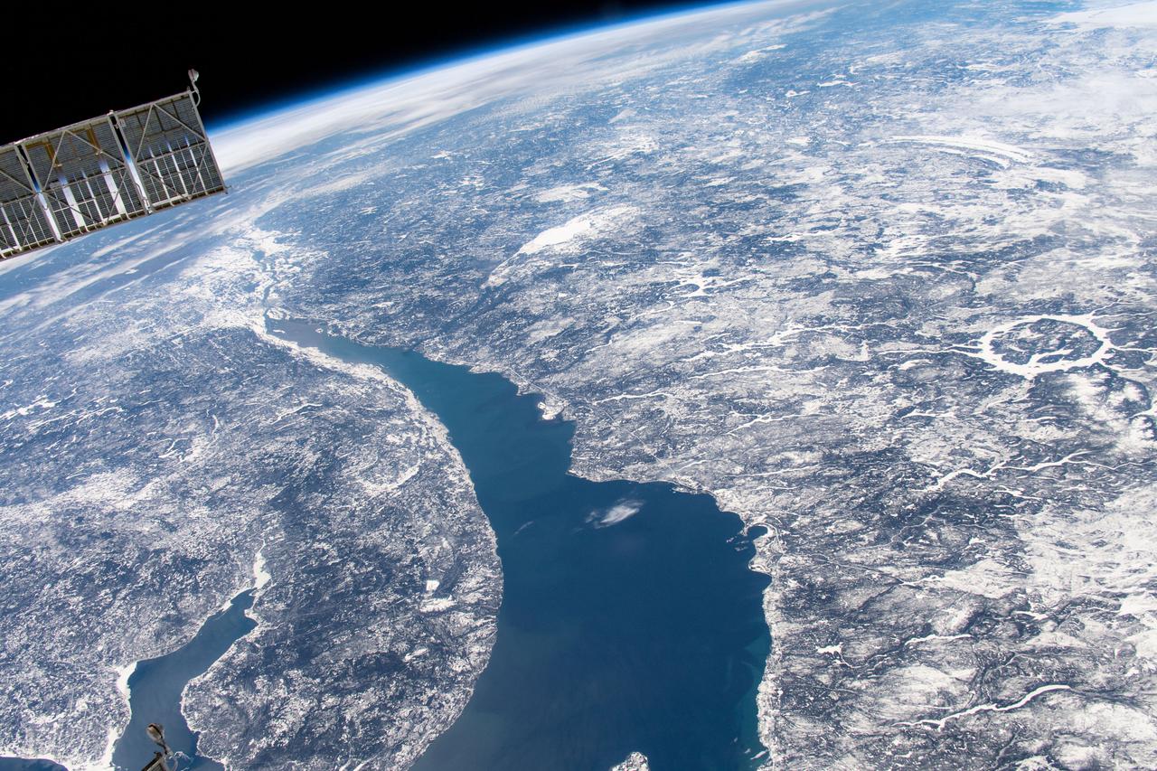 iss059e019043 (April 11, 2019) --- The International Space Station was orbiting 258 miles above Canada when an Expedition 59 crew member photographed Manicouagan Crater (right center) and the St. Lawrence River in Quebec.
