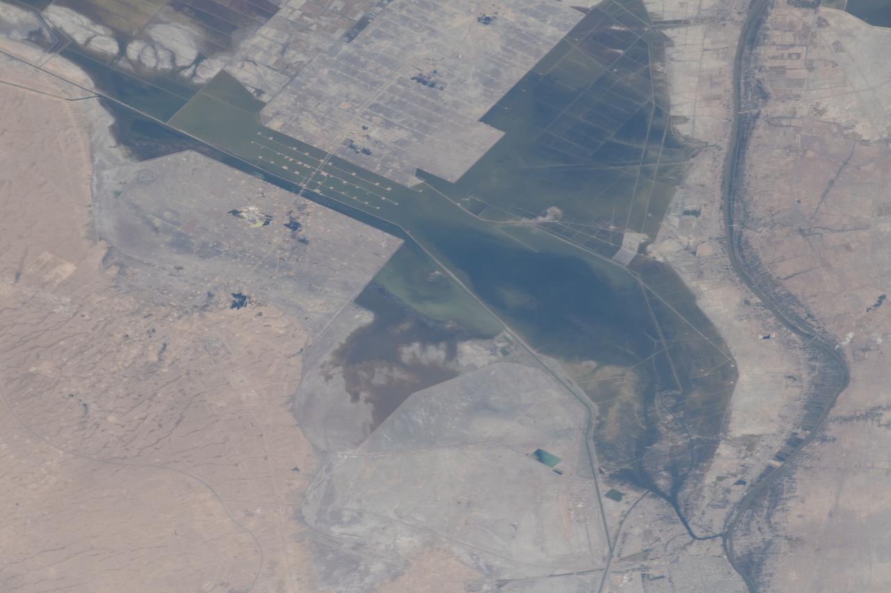 iss059e034570 (April 23, 2019) --- Severe flooding is seen near Basrah, Iraq, as unusually heavy and persistent rain doused several Middle Eastern countries in late March and early April 2019. At the same time, mountains were beginning to lose their snow cover to melting.