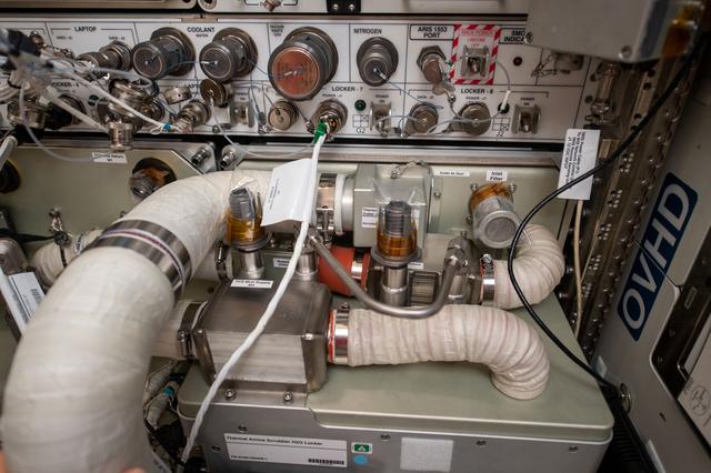 NASA image: In-Flight Maintenance Thermal Amine Installation