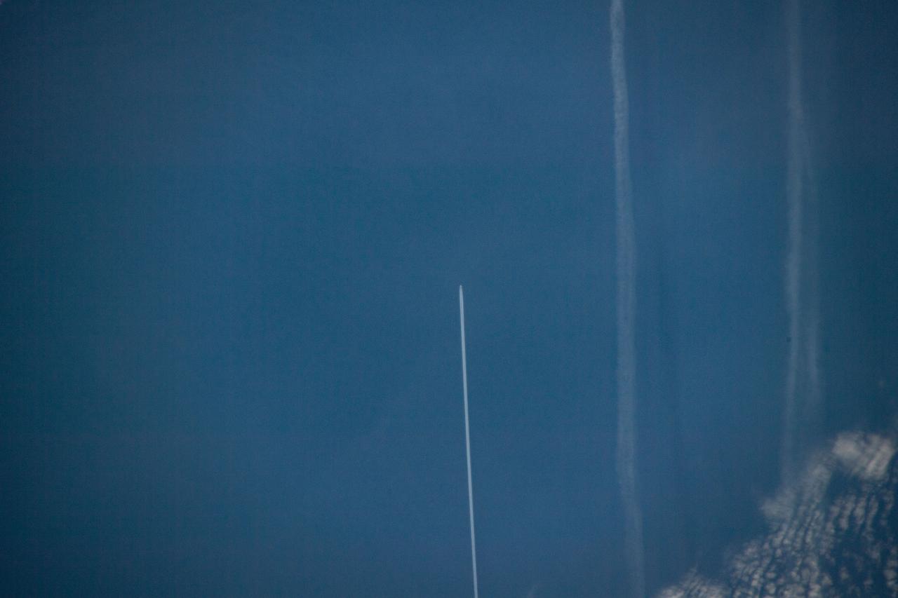 iss059e042046 (May 3, 2019) --- 258 miles above the North Atlantic Ocean an Expedition 59 crewmember photographed the contrail of an aircraft flying below as the International Space Station approached the coast of Ireland.