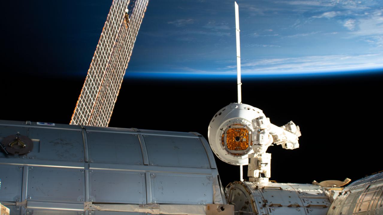 iss059e043274 (May 6, 2019) --- The SpaceX Dragon cargo craft is maneuvered toward the Harmony module's Earth-facing port by robotics controllers remotely operating the Canadarm2 robotic arm. Astronaut David Saint-Jacques earlier commanded the Canadarm2 robotic arm to capture Dragon as astronaut Nick Hague backed him up and monitored systems.