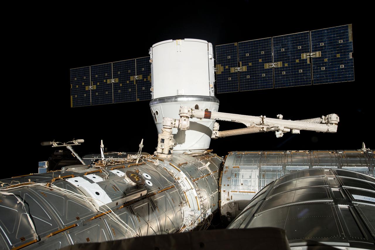 iss059e051334 (May 6, 2019) --- The SpaceX Dragon cargo craft is installed to the Harmony module's Earth-facing port a few hours after it was captured by astronauts David Saint-Jacques and Nick Hague with the Canadarm2 robotic arm.