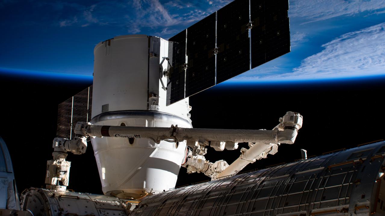 iss059e051356 (May 6, 2019) --- The SpaceX Dragon resupply ship is pictured berthed to the Harmony module as the International Space Station orbited 258 miles above east Asia. Dragon was still in the grips of the Canadarm2 robotic arm shortly after it was installed on Harmony.