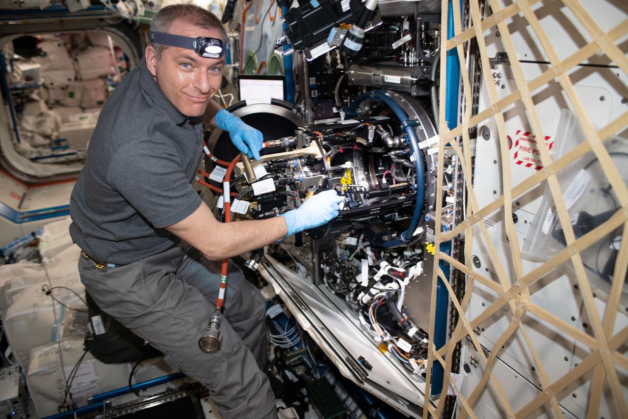 iss059e060847 (May 12, 2019) --- Astronaut David Saint-Jacques of the Canadian Space Agency works on the Combustion Integrated Rack located inside the U.S. Destiny laboratory module. Saint-Jacques was working on hardware supporting the Advanced Combustion via Microgravity Experiments (ACME). ACME is a set of five independent studies of gaseous flames exploring improved fuel efficiency, reduced pollution and spacecraft fire prevention.