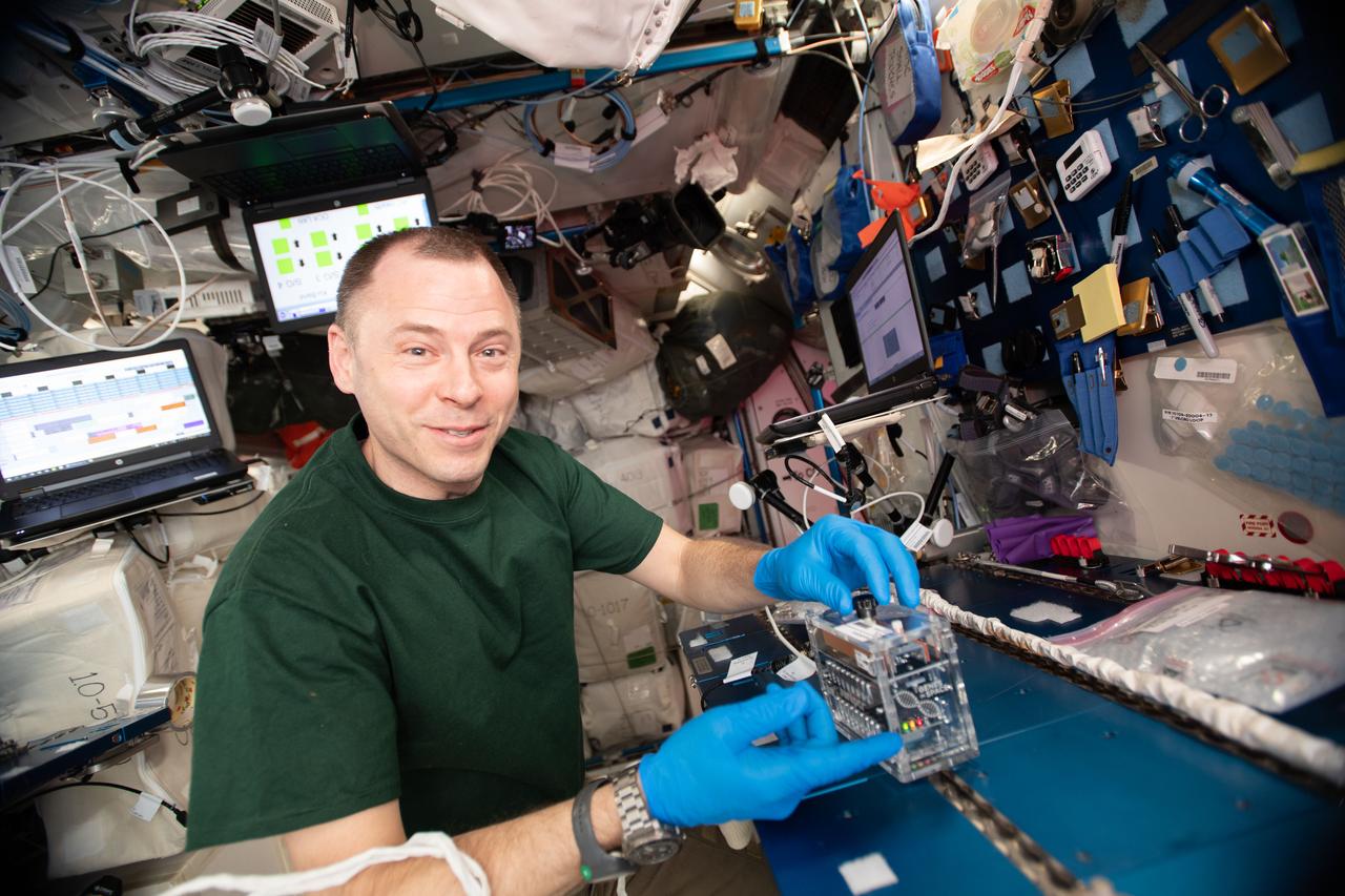 iss059e060940 (May 12, 2019) --- NASA astronaut Nick Hague works with the miniPCR hardware inside the Columbus laboratory module for the Genes In Space-6 experiment that is exploring how space radiation damages DNA and how the cell repair mechanism works in microgravity.