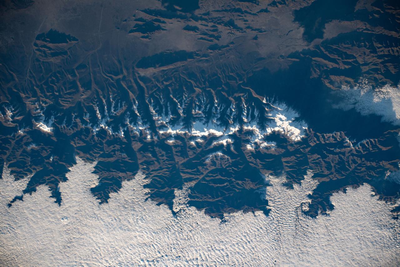 iss059e067738 (May 19, 2018) --- Snow-capped mountain tops are pictured as the International Space Station orbited 257 miles above the Andes mountain range along the western coast of South America.