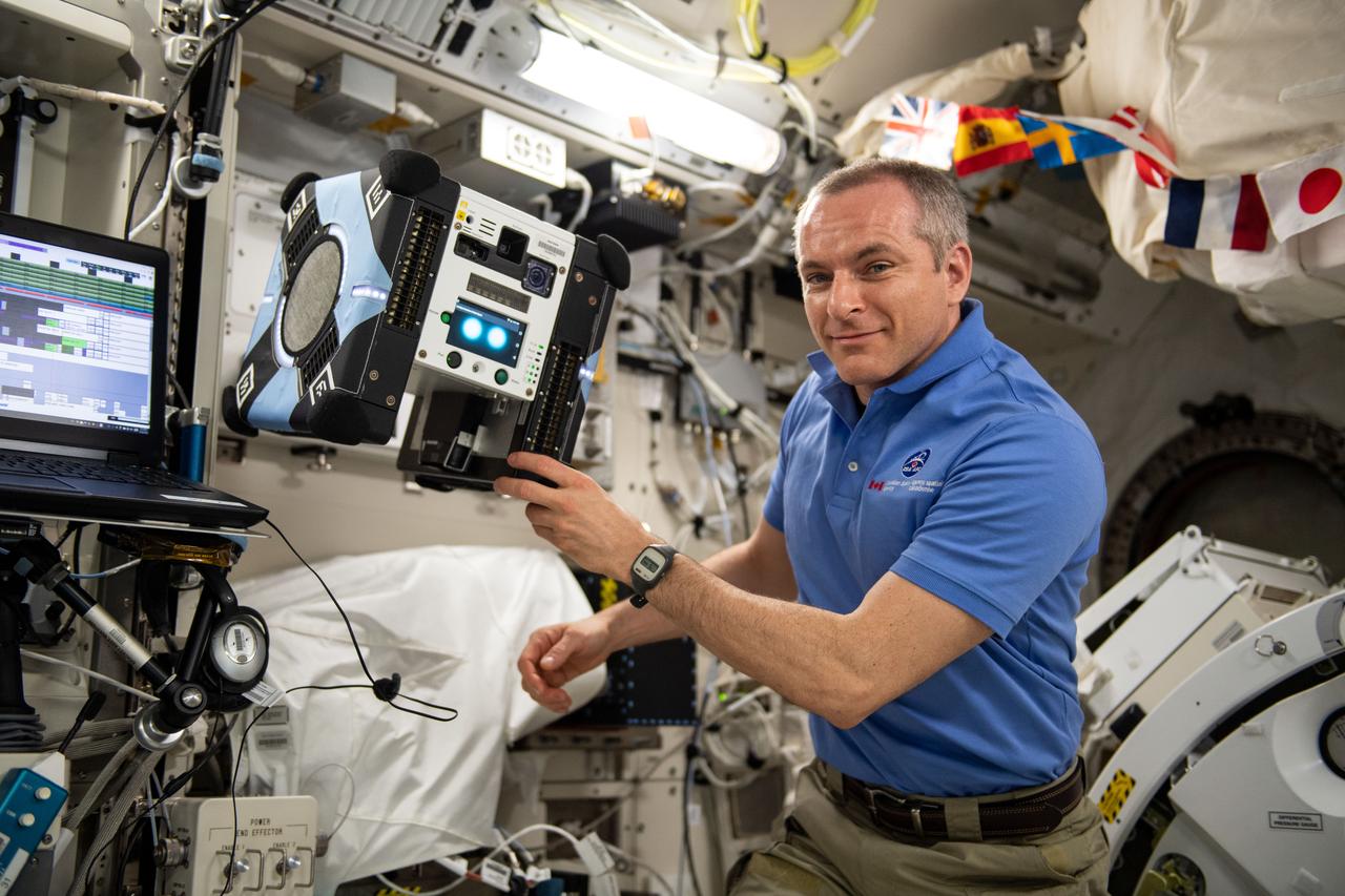 iss059e072518 (5/23/2019) --- Canadian Space Agency (CSA) astronaut David Saint-Jacques is photographed working with the free-flying Astrobee cube named Bumble and the docking station onboard the International Space Station (ISS). Astrobee consists of three self-contained, free flying robots and a docking station for use inside the ISS. It is an autonomous free flyer powered by fans and operates in the entire U.S. Operating Segment (USOS) using vision-based navigation. The autonomous robots are operated remotely from the ground.