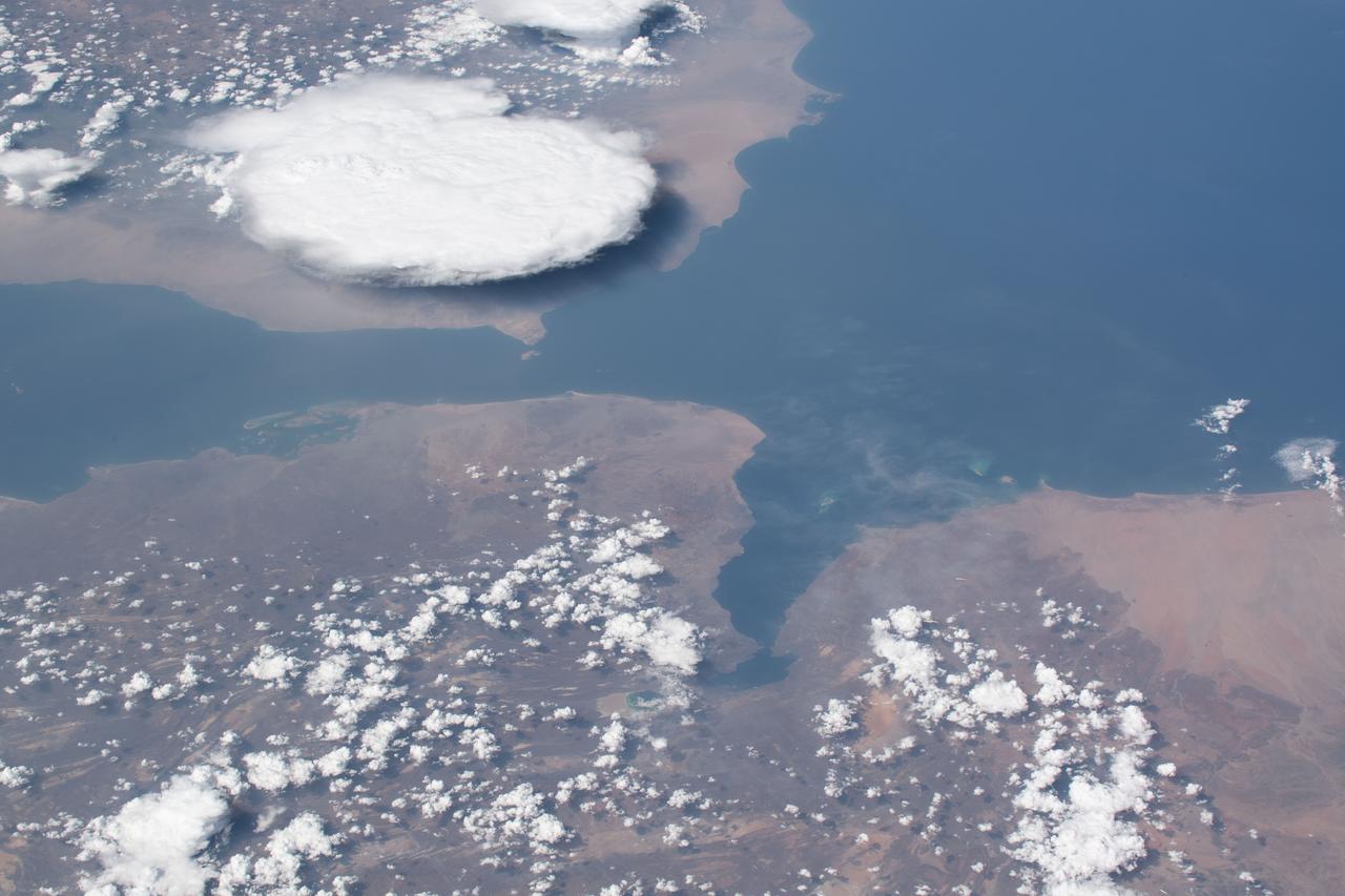 iss059e078914 (May 29, 2019) --- Storm clouds are seen on the southwestern coast of Yemen as the International Space Station was about to fly 254 miles over the Bab al-Mandab Strait in between the Gulf of Aden and the Red Sea.