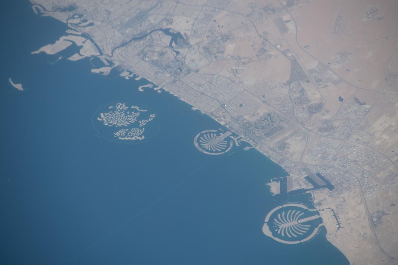 iss059e078929 (May 29, 2019) --- The artificial islands off the coast of Dubai in the United Arab Emirates are known as (from left) The World Islands, Palm Jumeirah and Palm Jebel Ali. The International Space Station was orbiting 255 miles above Saudi Arabia about to cross the Persian Gulf when this photograph was taken by an Expedition 59 crewmember.
