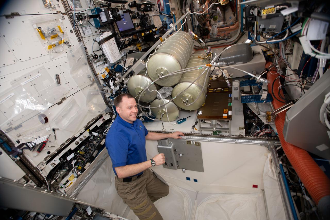 iss059e079472 (May 29, 2019) --- NASA astronaut Nick Hague assembles and installs the Water Storage System inside the U.S. Destiny laboratory module.