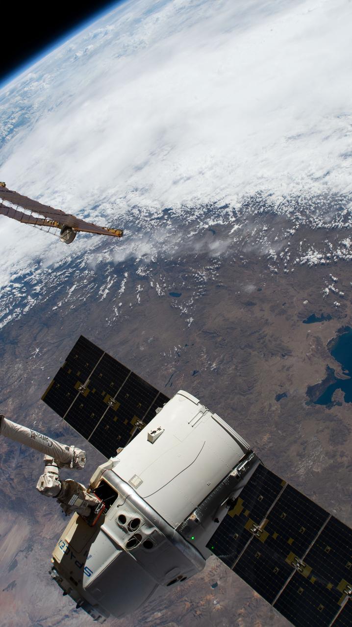 iss059e088880 (June 3, 2019) --- The SpaceX Dragon cargo craft on its 17th contracted mission to resupply mission to the International Space Station is pictured moments before being released from the Canadarm2 robotic arm. The orbiting lab was flying 257 miles above the Pacific coast of South America.