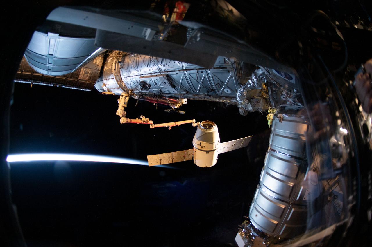 iss059e088998 (June 3, 2019) --- The SpaceX Dragon cargo craft on its 17th contracted mission to resupply mission to the International Space Station is pictured moments before being released from the Canadarm2 robotic arm.
