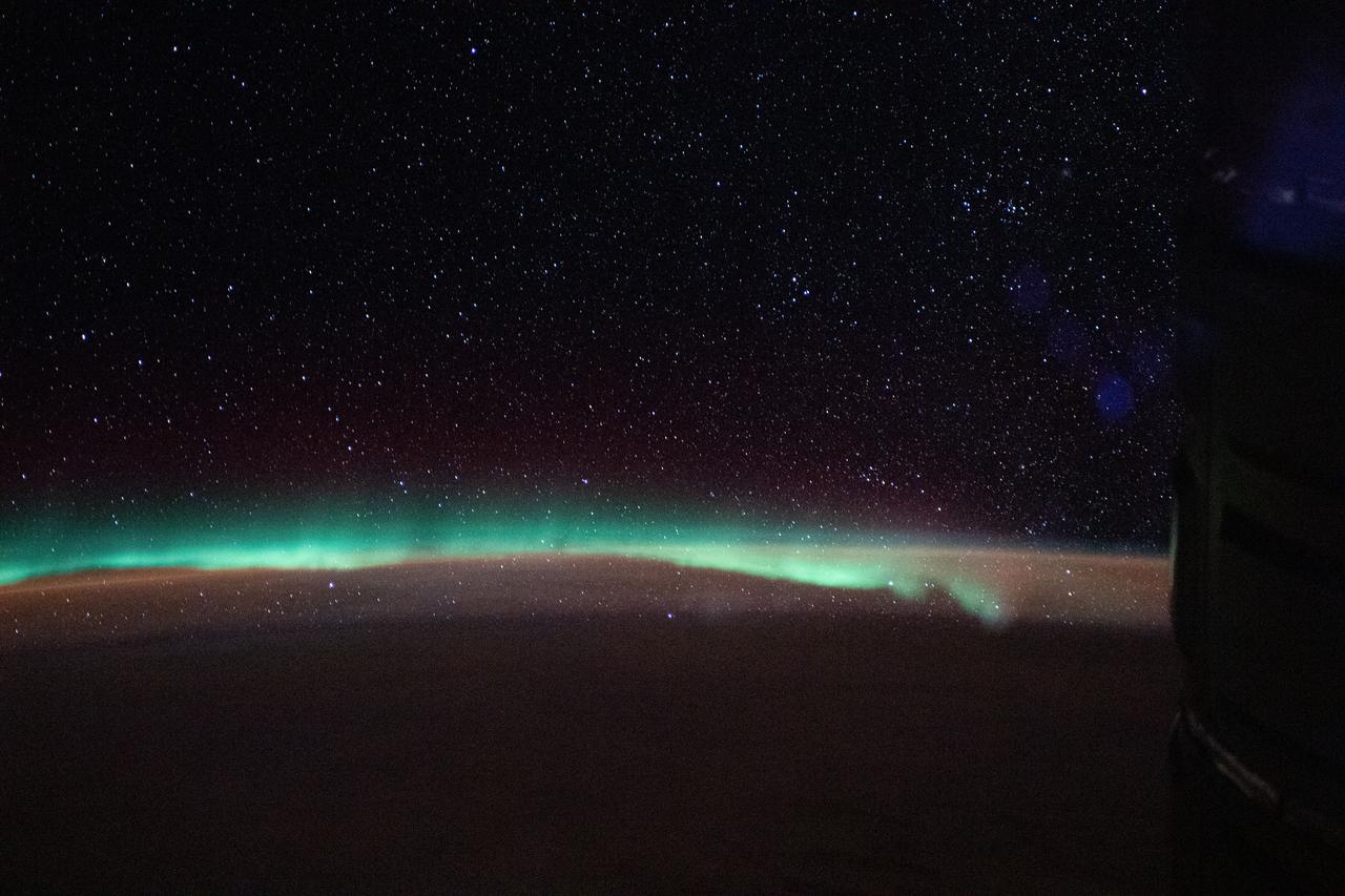 iss059e092459 (June 5, 2019) --- The aurora australis, or "southern lights," highlights a starry nighttime orbital pass as the International Space Station orbited 267 miles above the Indian Ocean southeast of Madagascar.