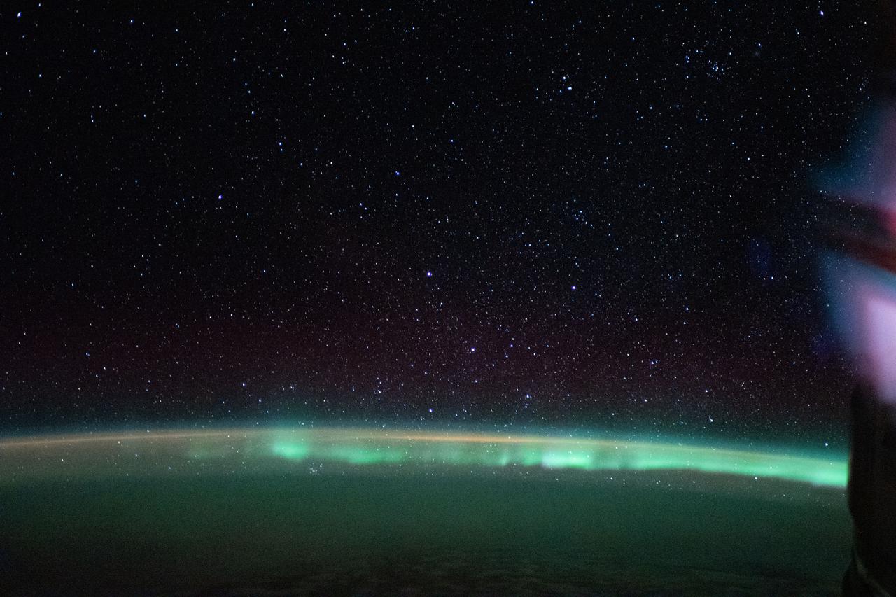 iss059e092462 (June 5, 2019) --- The aurora australis, or "southern lights," highlights a starry nighttime orbital pass as the International Space Station orbited 269 miles above the Indian Ocean southwest of Australia.