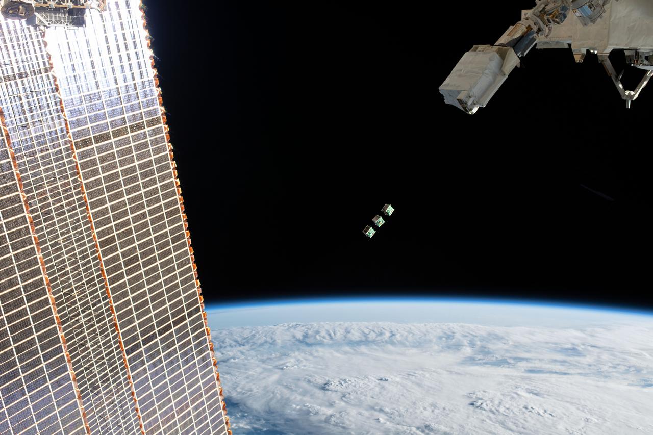 iss059e104296 (June 17, 2019) --- A set of three CubeSats are ejected from the Japanese Small Satellite Orbital Deployer attached to a robotic arm outside of the Japan Aerospace Exploration Agency's Kibo laboratory module. The tiny satellites from Nepal, Sri Lanka and Japan were released into Earth orbit for technology demonstrations. The International Space Station was orbiting 256 miles above the Amazon River in Brazil when an Expedition 59 crewmember took this photograph.