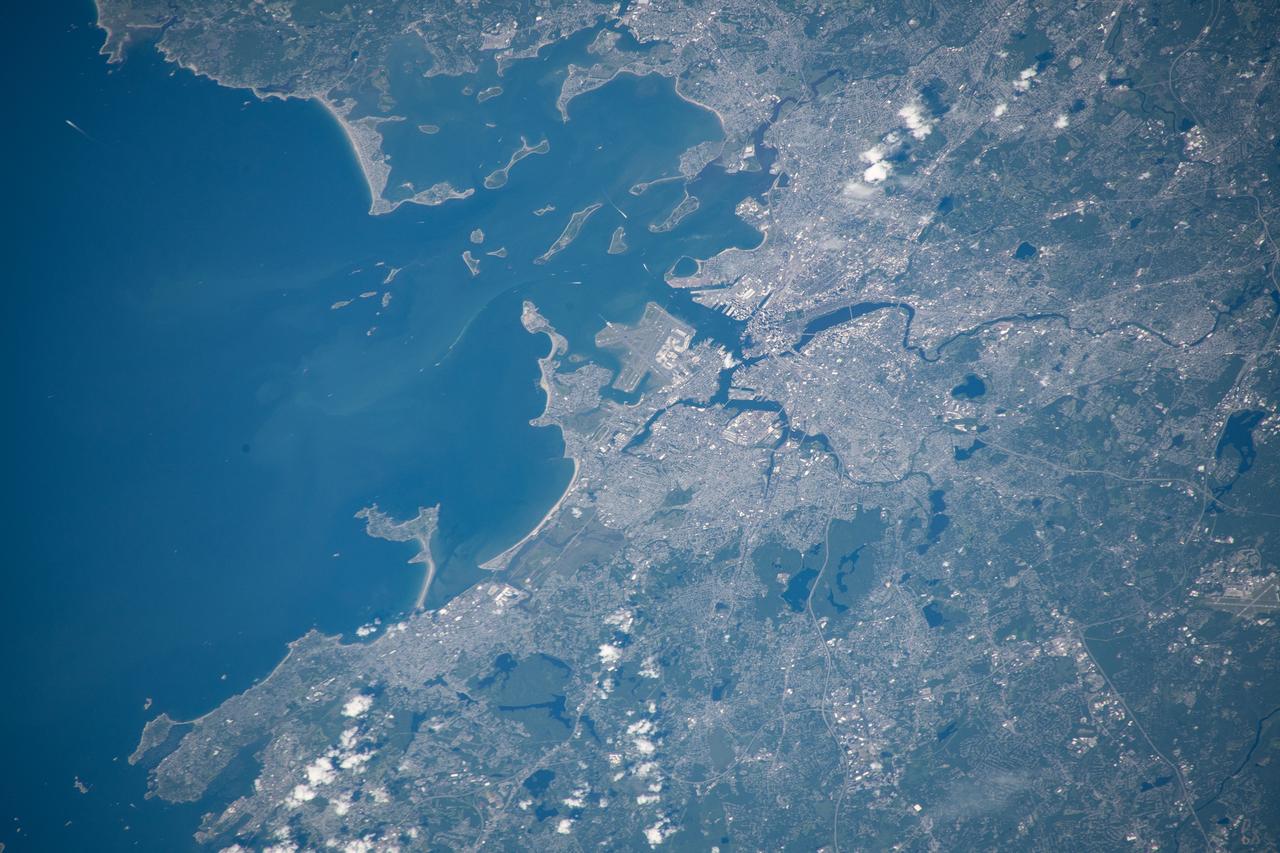 iss059e111579 (June 17, 2019) --- Boston, Massachusetts, Logan International Airport and Massachusetts Bay figure prominently in this photograph taken 255 miles above the Atlantic Ocean from the International Space Station.