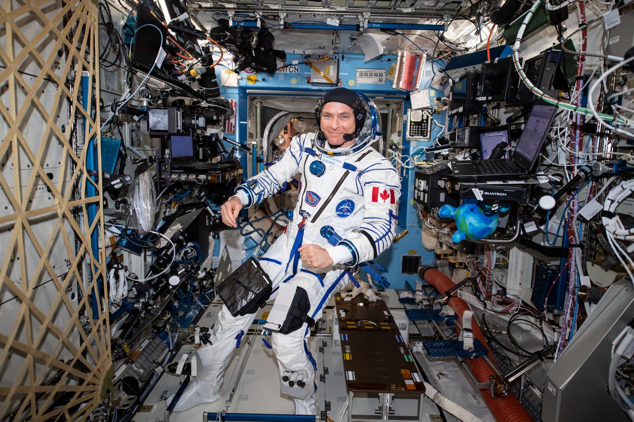 iss059e111674 (June 17, 2019) --- Astronaut David Saint-Jacques of the Canadian Space Agency wears his Sokol launch and entry suit during a leak check before he departs the International Space Station on June 24. He and fellow Expedition 59 crewmembers Anne McClain of NASA and Oleg Kononenko of Roscosmos will wear their Sokol suits when they return to Earth inside the Soyuz MS-11 spacecraft completing a 204-day mission.