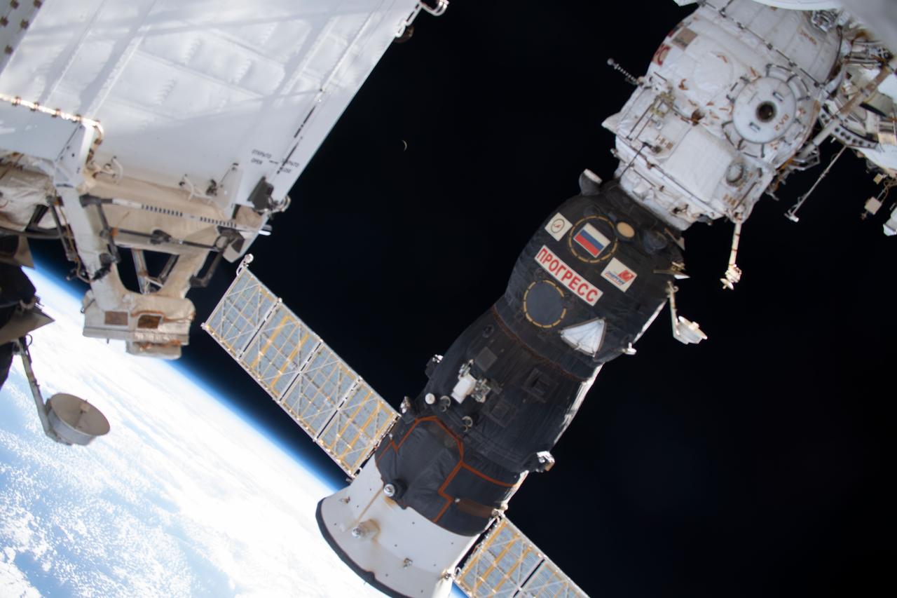 iss060e001774 (June 29, 2019) --- A waning crescent moon is barely visible in the center background as the International Spacer Station orbited 262 miles above the Indian Ocean east of Madagascar. Dominating the foreground is Russia's Progress 72 resupply ship docked to the Pirs module.