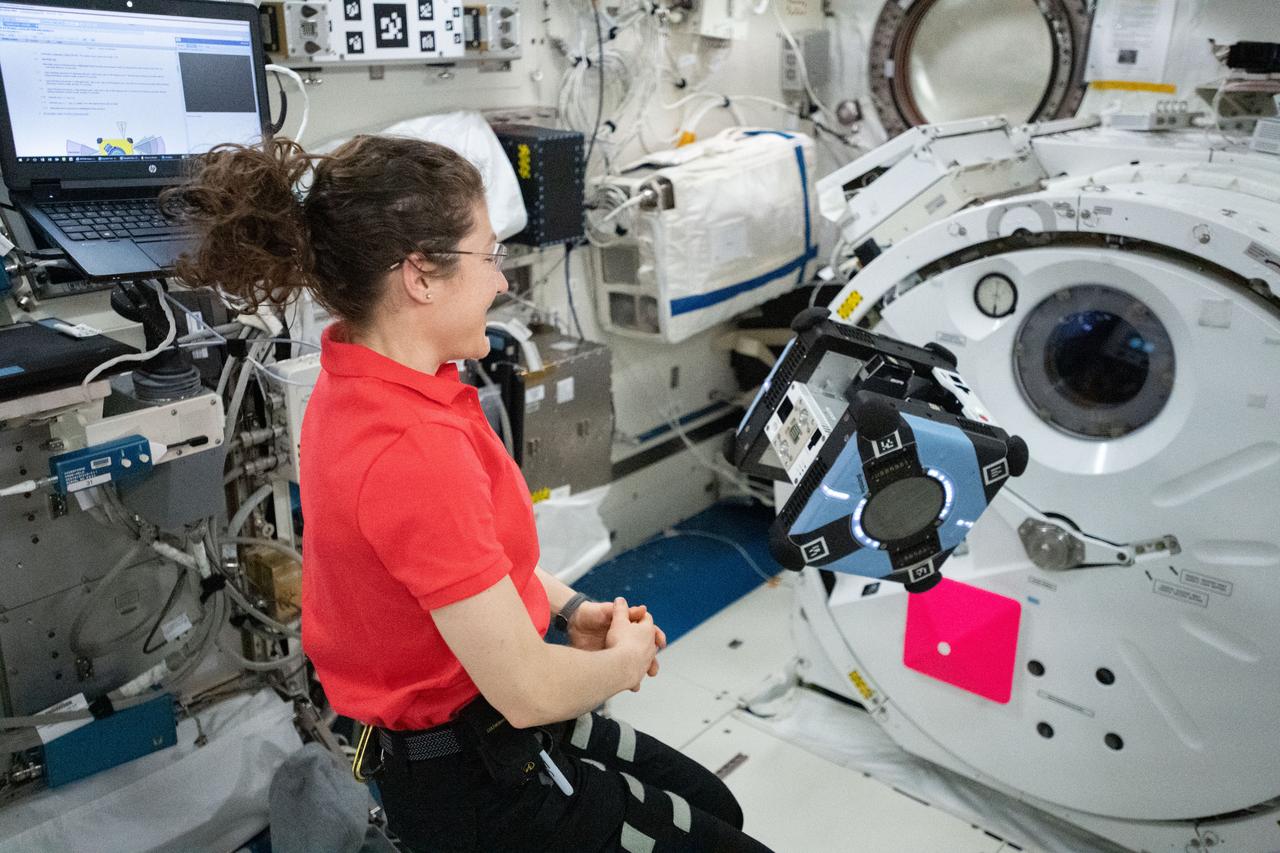 iss060e007162 (July 12, 2020) --- NASA astronaut and Expedition 60 Flight Engineer Christina Koch tests the mobility of the free-flying Astrobee robotic assistant inside the Kibo laboratory module. Astrobee consists of three self-contained, free flying robots and a docking station inside the International Space Station.