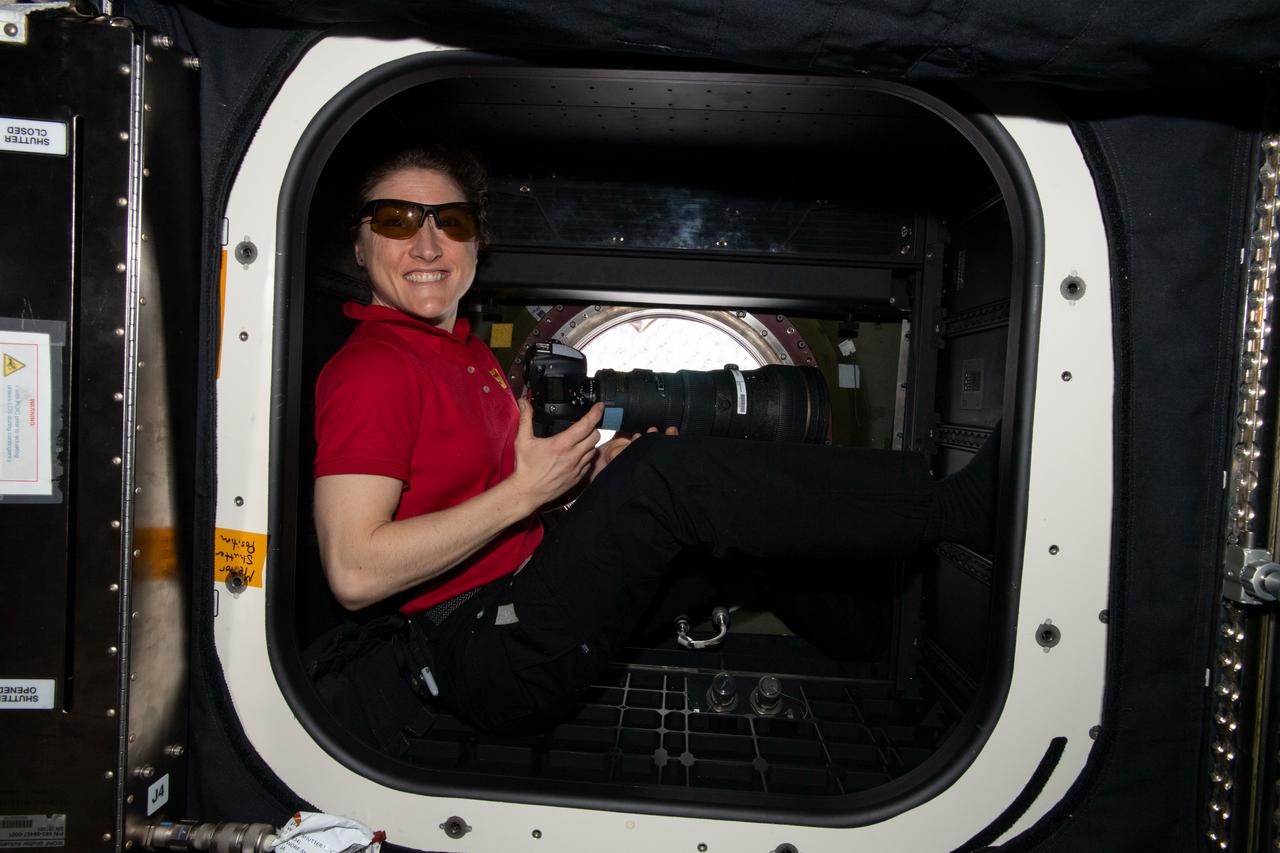 iss060e014992 (July 27, 2019) --- Expedition 60 Flight Engineer Christina Koch of NASA rests inside the U.S. Destiny laboratory module's Window Observation Research Facility (WORF). She is wearing specialized goggles to protect her eyes from the Sun's rays while photographing Earth landmarks from the International Space Station.