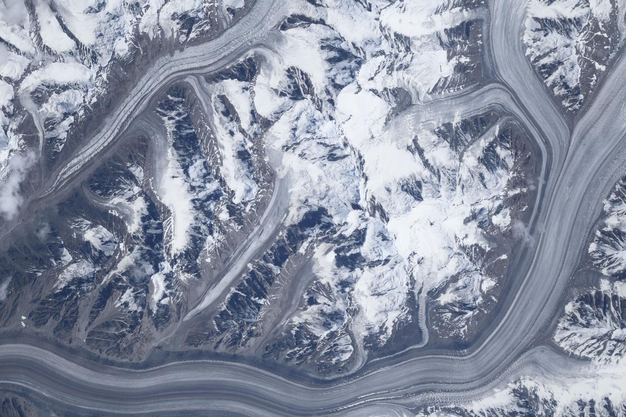 iss060e033225 (Aug. 7, 2019) --- Glaciers are pictured in the Pamir Mountains as the International Space Station orbited above Tajikistan. Credit: Roscosmos