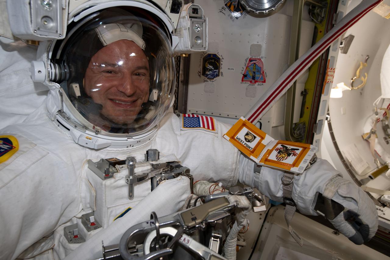 iss060e038222 (Aug. 21, 2019) --- NASA astronaut Andrew Morgan is pictured in his U.S. spacesuit inside the International Space Station's Quest airlock preparing to begin a six-hour and 32-minute spacewalk to install the orbiting lab’s second commercial crew vehicle docking port, the International Docking Adapter-3 (IDA-3). The IDA-3 will accommodate the future arrivals of Boeing CST-100 Starliner and SpaceX Crew Dragon commercial crew spacecraft.